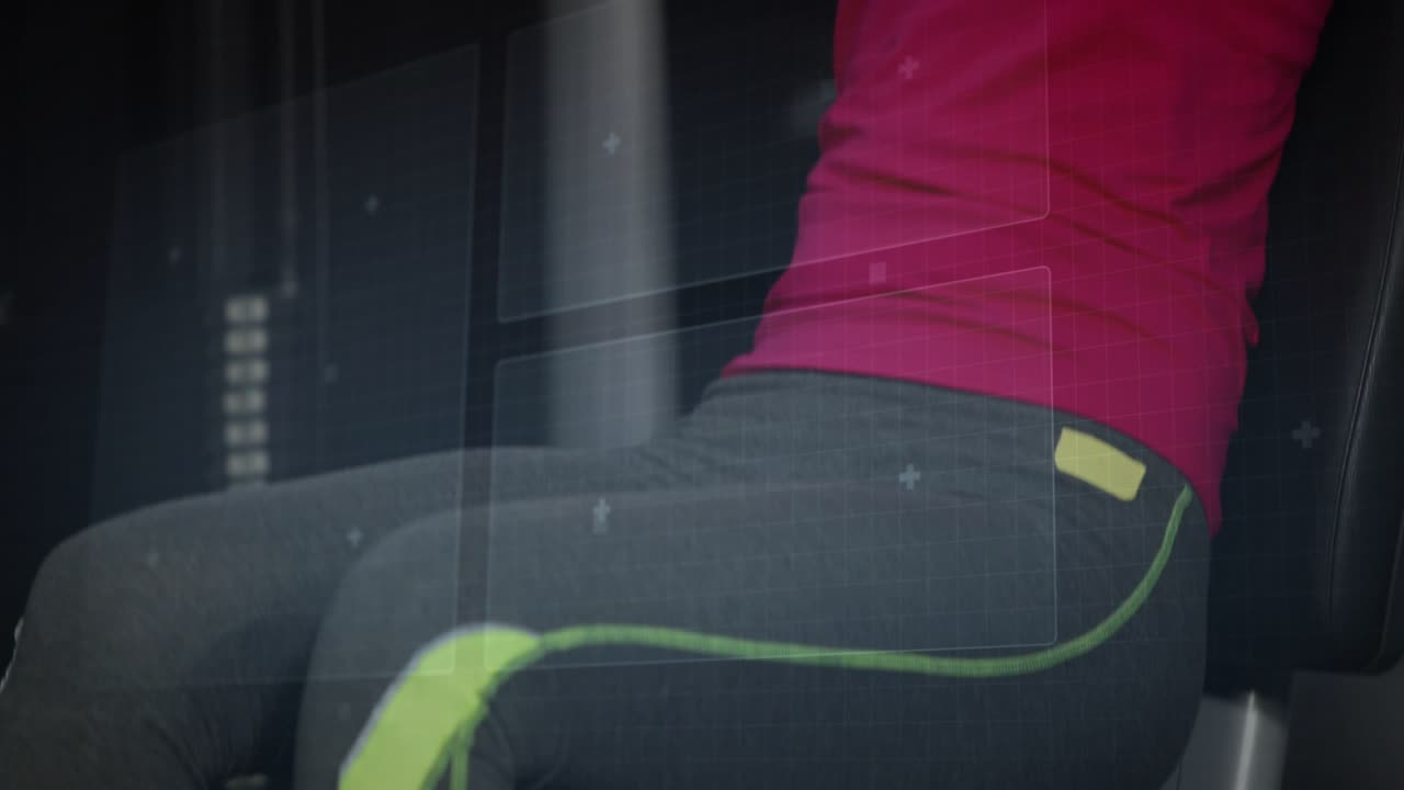 Woman grasping handles and doing seated pushing pulls in gym, HUD overlaying machine for strength
