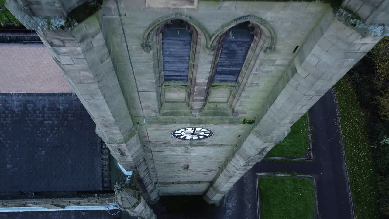 Aerial View of a Church Tower with a Clock