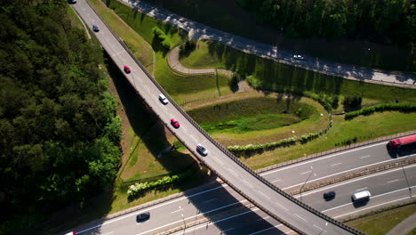 aerial view of vehicles driving through e28 and s26 road on a sunny day in gdynia, poland