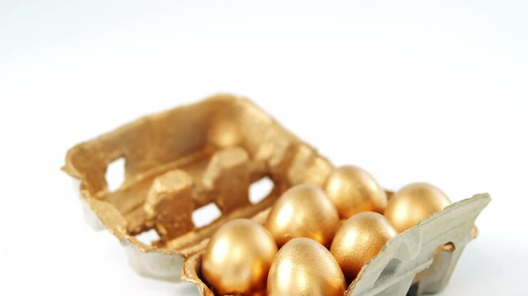 Close-up of golden Easter eggs in the tray
