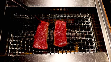 steaks grilling over time on a barbecue