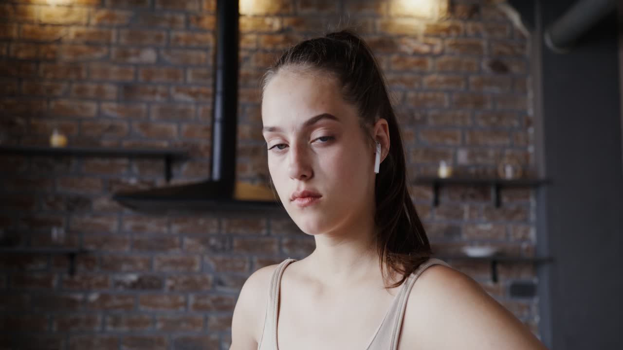 Portrait of a Young Woman with Earbuds