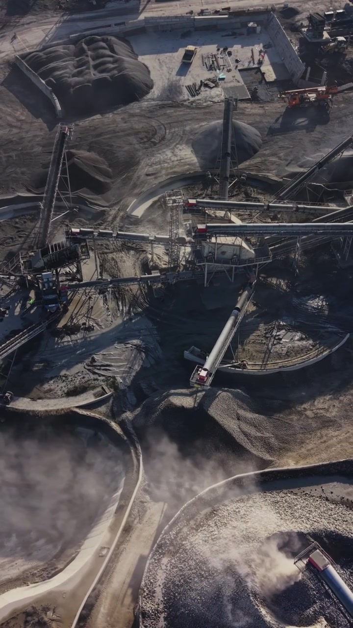 Quarry site showing mining activity and material processing in operation