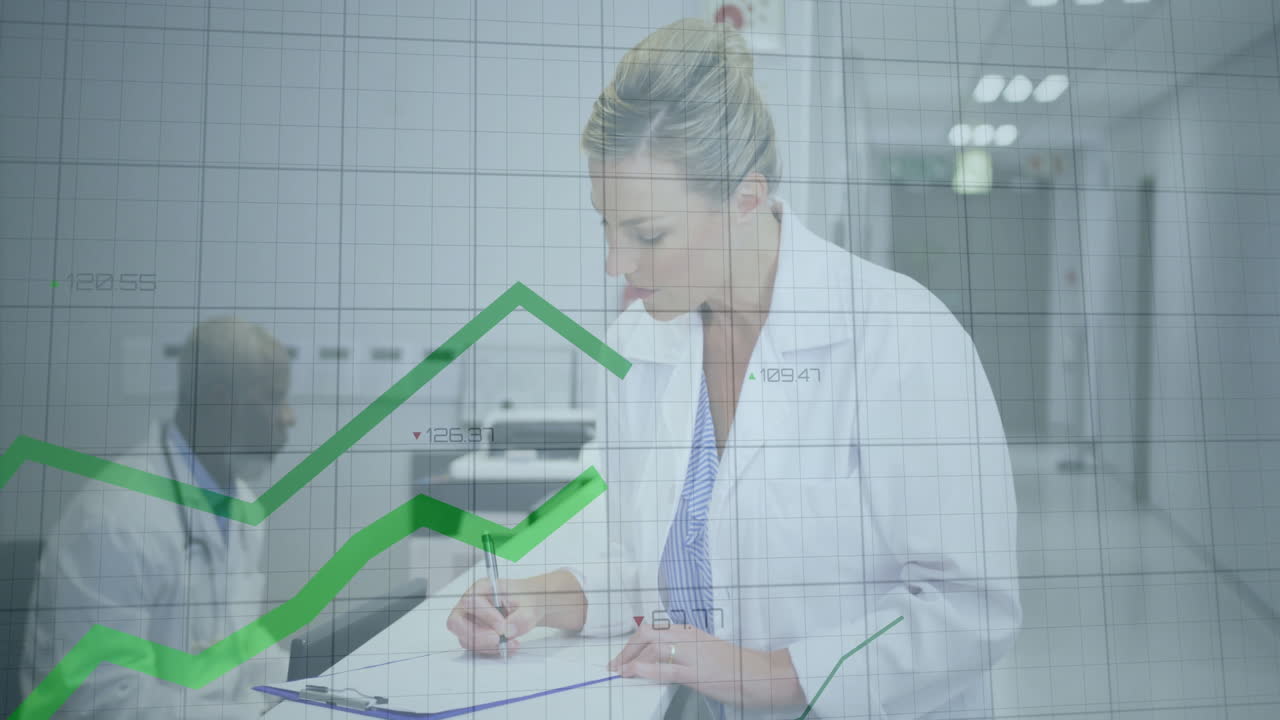 Writing with financial graph animation, medical professional in office setting