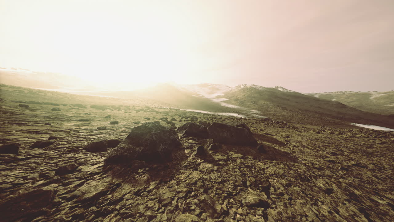 Breathtaking landscape illuminated by a golden sunrise over rocky terrain