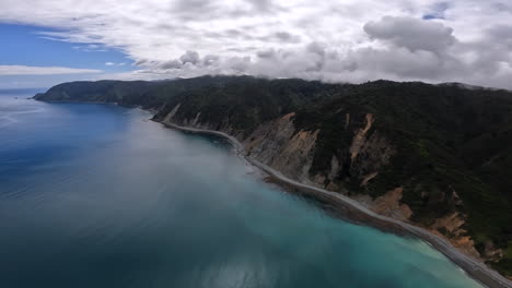 aerial flying along the marlborough sounds coastline in new zealand