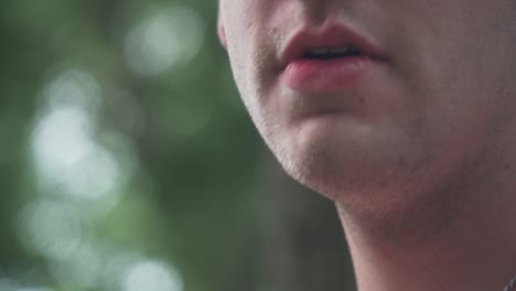 close up of male model smoking vaporizer outside 60fps