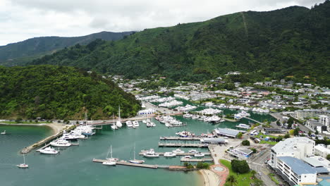 Picton-township-with-boats-in-New-Zealand,-aerial-drone-view