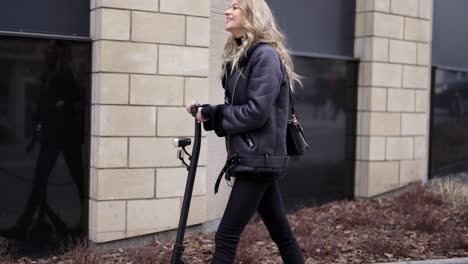 woman riding electric scooter in city