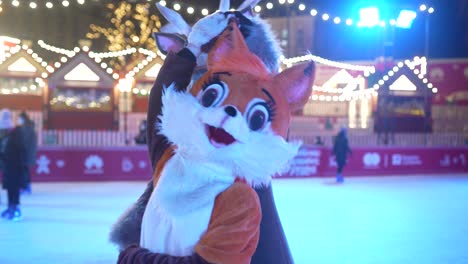 children in animal costumes at an ice skating rink