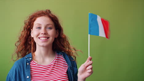 young woman holding french flag