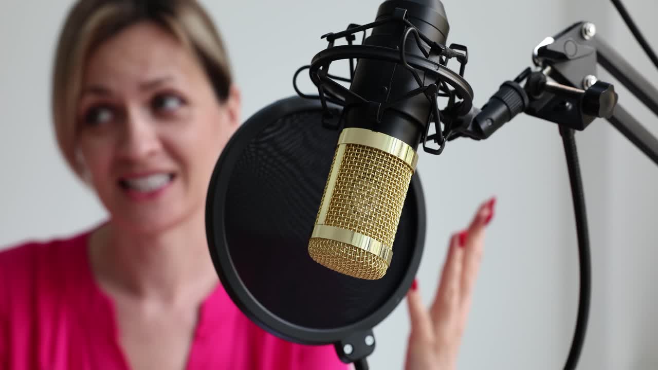 Woman recording podcast with microphone