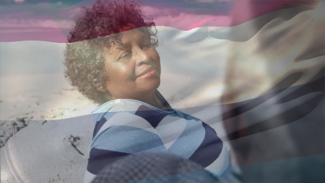 Senior woman responding to man speaking on beach, smiling while pink blue overlay tints for health