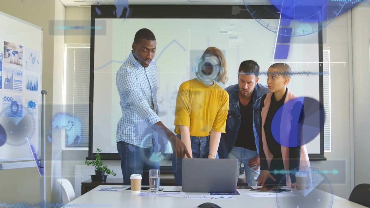 Office team leaning at laptop tapping pad and causing overlay growing then fading reviewing charts