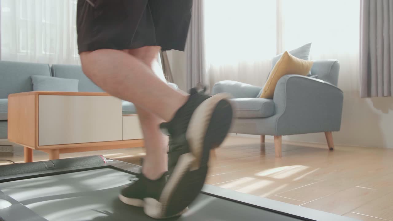 Man Running on Treadmill at Home
