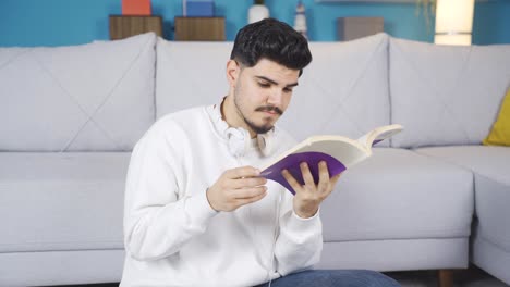 Young-man-reading-a-book.