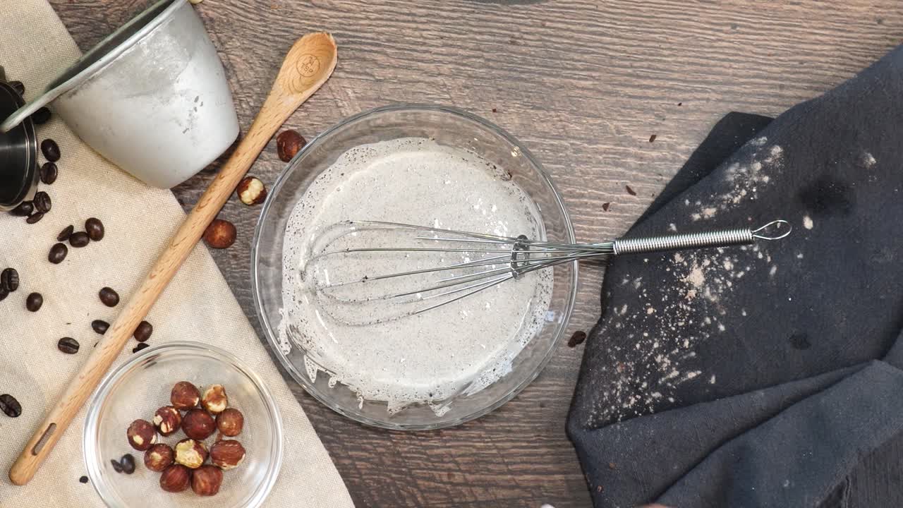 A delicious dessert, Coffee Hazelnut Cream Tart. Made with espresso powder, chocolate crust and loaded with crushed hazelnut. Adding unflavored gelatin to the batter on a wooden counter