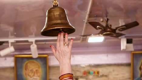 devotee-ringing-the-holly-bell-at-temple-at-morning