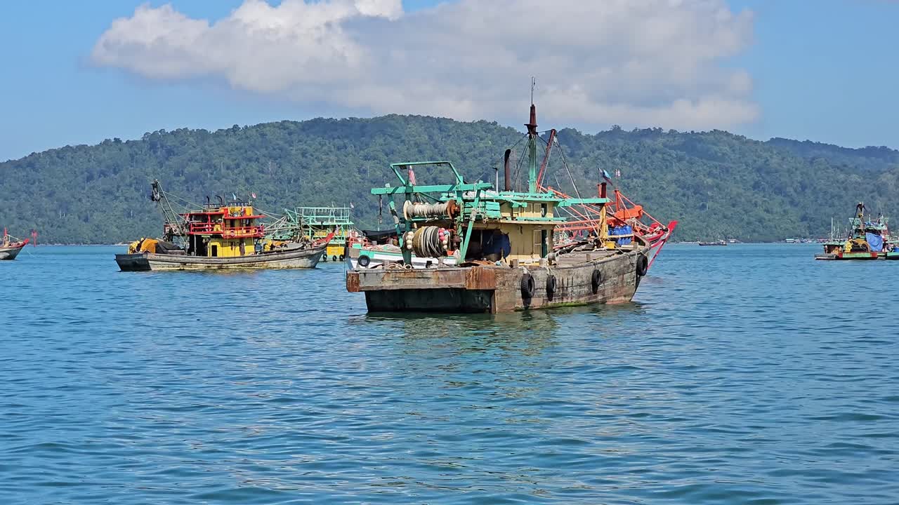 Wooden Fishing Vessels Floating In The Sea In Kota Kinabalu, Sabah, Malaysia. wide static shot