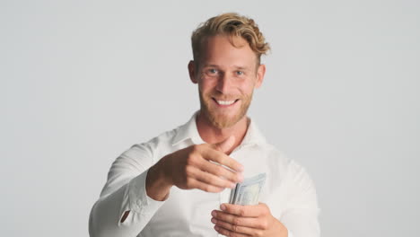 happy businessman throwing money at front