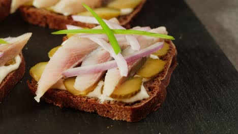 herring sandwiches with pickles and onions