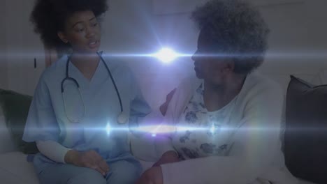 Animation-of-digital-lights-moving-over-african-american-doctor-talking-with-patient-in-hospital