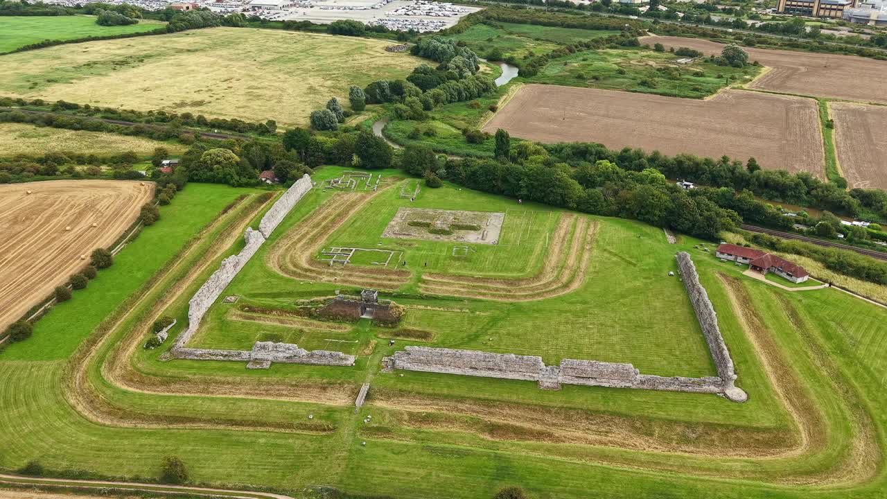 Orbiting aerial view of the historic Richborough Roman Fort ruins in Kent, England