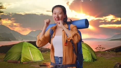 happy woman camping and dancing at sunset