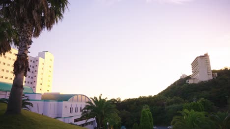 sunrise over hilltop hotels on the japanese coastline of toba