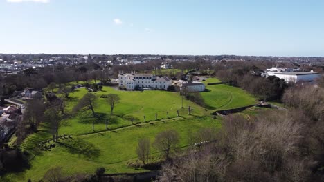 Guernsey-flight-over-Les-Cotils-Christian-Centre-St-Peter-Port-heading-westward-on-bright-clear-day-with-views-over-the-Island