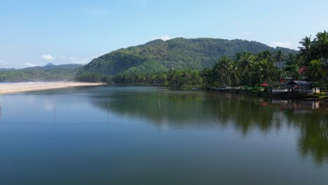 smooth calm estuary water with mountain in background