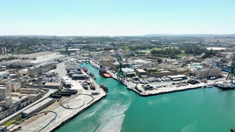 aerial drone shot towards a boat yard from far away