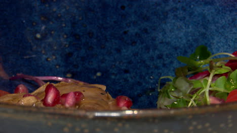 chicken salad dish with pomegranate