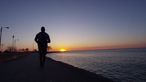 african american male sunset silhouette doing running workout