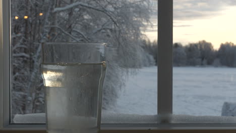 throwing fizzy tablet into glass of water to get vitamins on cold winter season