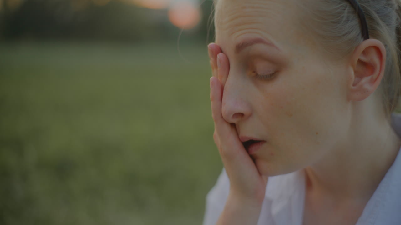 Close-Up of Woman Rubbing Tired Eyes
