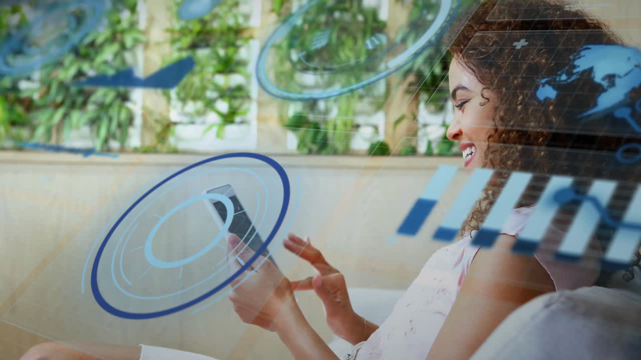 Woman on couch tapping and swiping tablet in tech demo, generating rotating HUD globe over device