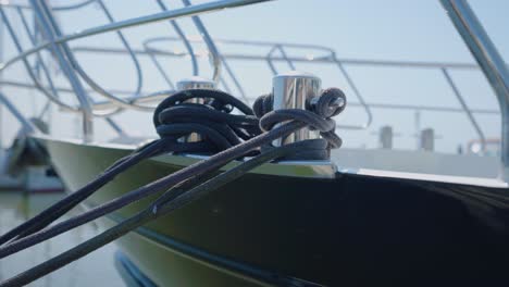 Close-up-of-yacht-hitch-with-rope-tied-on,-slow-motion