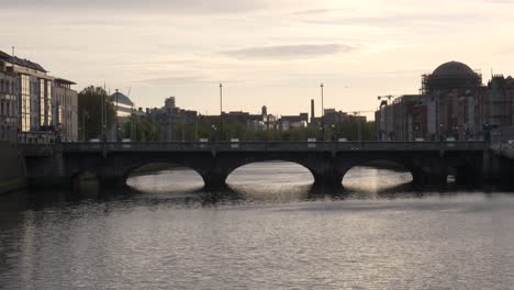 grattan bridge over liffey river on late evening near dublin city centre in ireland