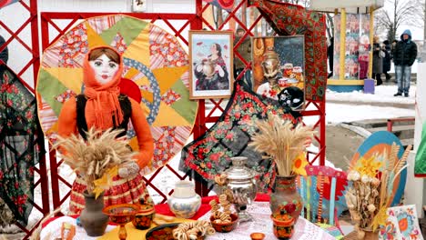 russian samovar and belarusian folk dolls. table with baranki. traditional russian tea drinking