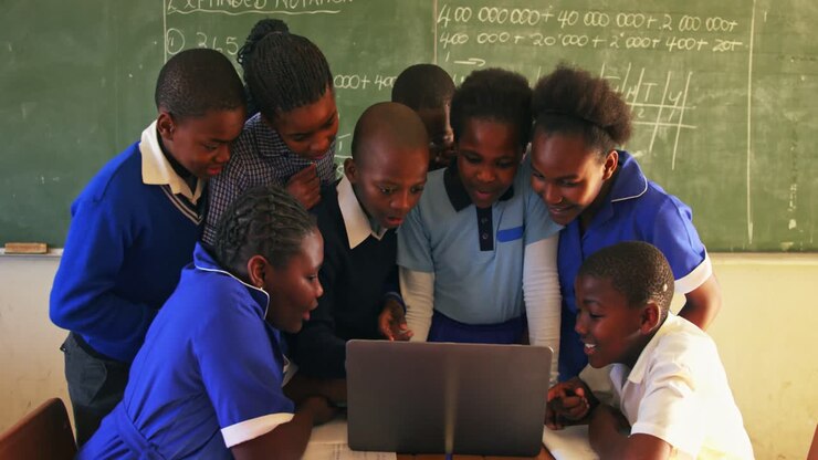 Schoolchildren with laptop in a lesson at a township school 4k
