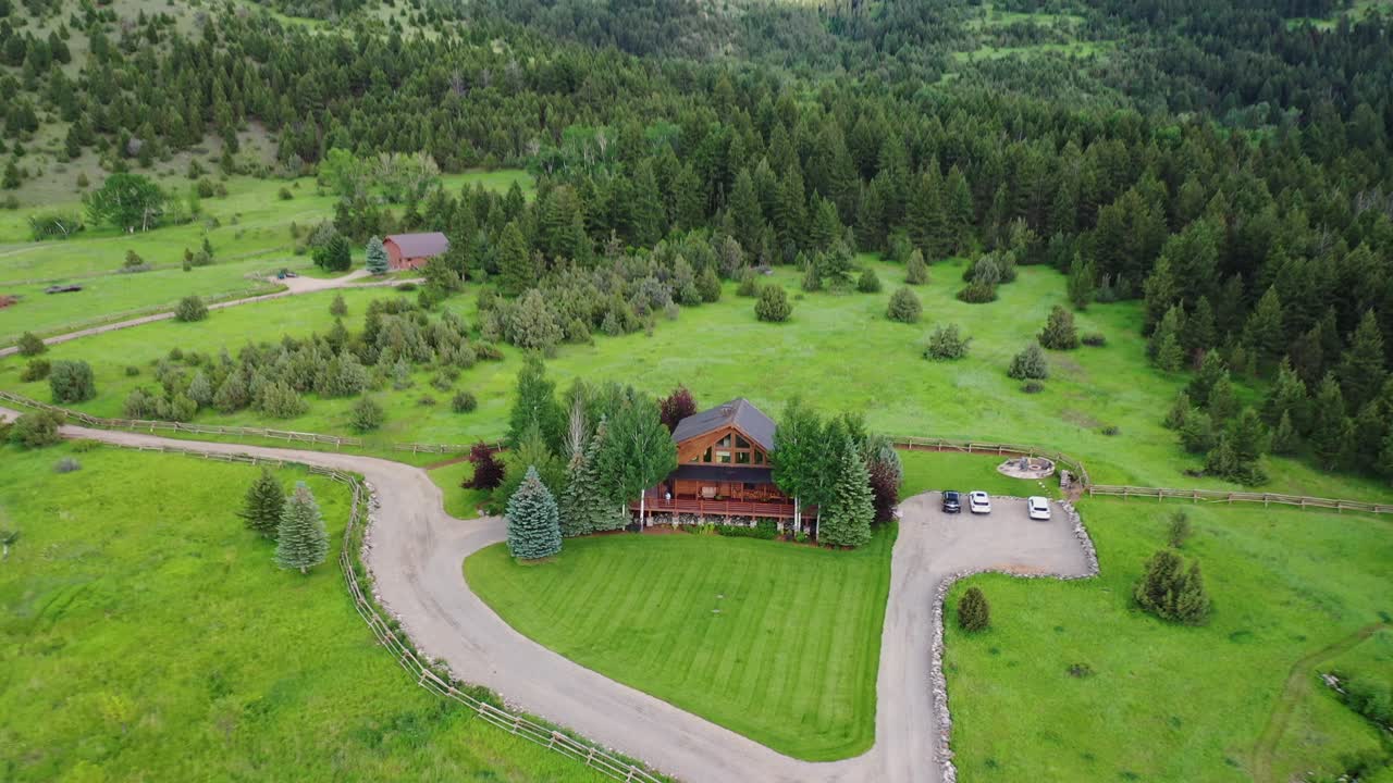 Drone races over secluded cabin in the middle of Paradise Valley Montana