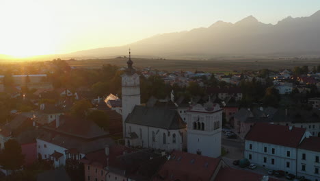 drone shot flying past the church of st