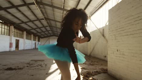 female dancer in an empty warehouse