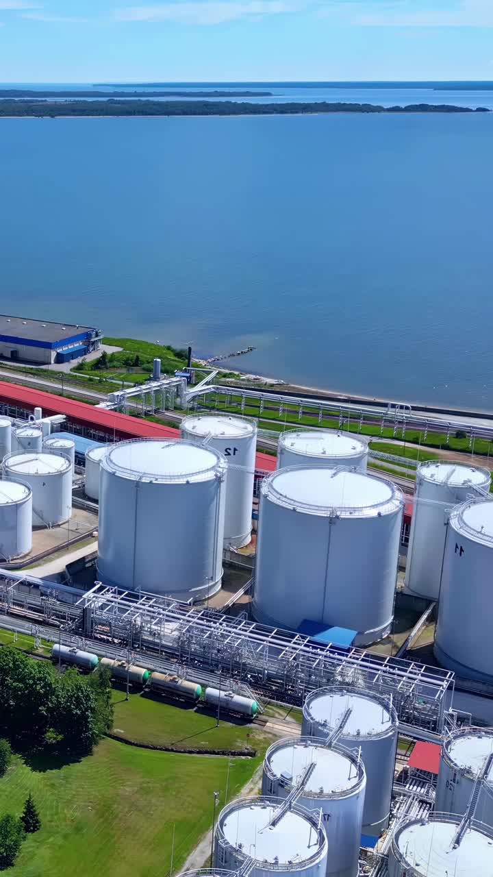 Large scale industrial facility oil fuel storage terminal Baltic Sea LPG rail transport hub vertical
