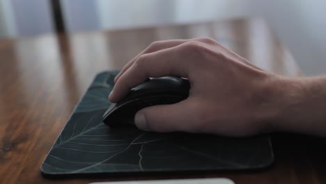 man hand clicking buttons on pc mouse