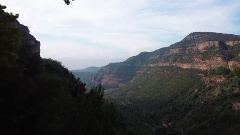 Scenic-view-of-Sant-Miquel-del-Fai-in-Barcelona-with-lush-greenery-and-towering-cliffs