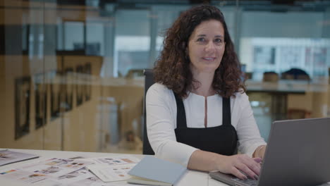 portrait of mature female interior designer at workplace in the office