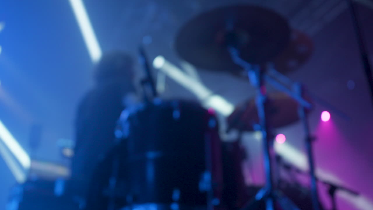 Drummer performing live on stage