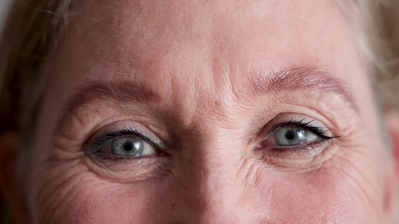 Close-up of senior woman's eyes, gentle expression showing wisdom and experience, at home